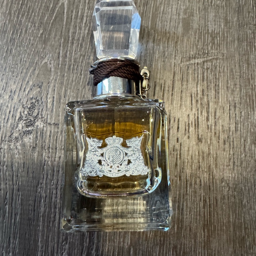 Juicy Couture Clear Perfume Bottle with Gold Hue